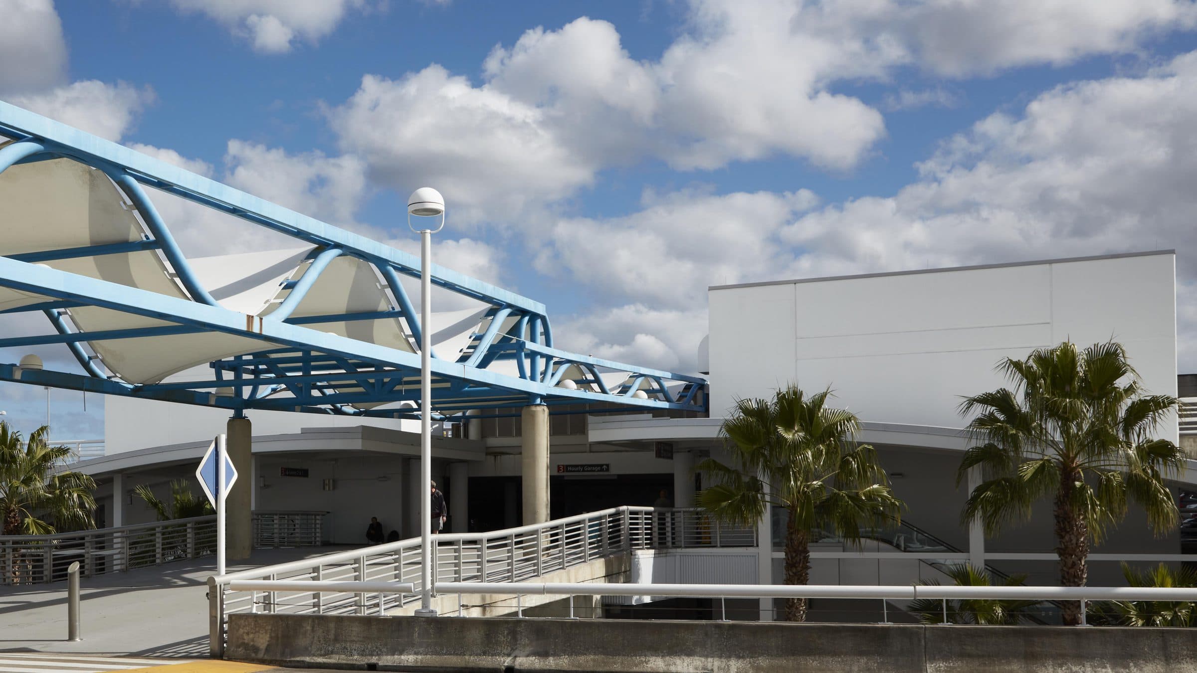 The upper-level roadway and its wave-shaped canopy at Jacksonville International Airport